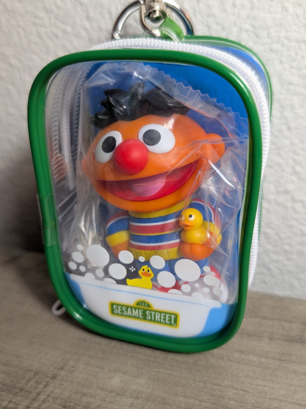 Sesame Street Ernie Bath Toy Pouch with Red-Nosed Figure and Green Trim